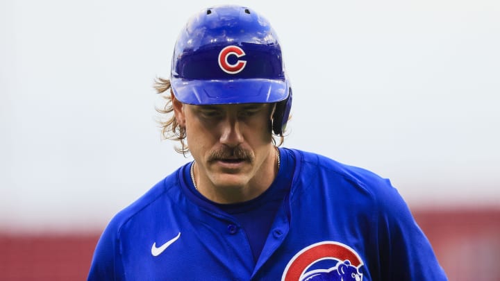 Jul 31, 2024; Cincinnati, Ohio, USA; Chicago Cubs first baseman Patrick Wisdom (16) walks off the field after being called out on a two-run sacrifice fly out in the third inning against the Cincinnati Reds at Great American Ball Park