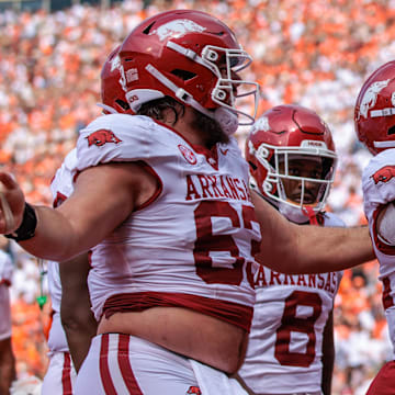 Arkansas Razorbacks running back JaQuinden Jackson (22) celebrates in the end zone after scoring a touchdown during the first quarter against the Oklahoma State Cowboys at Boone Pickens Stadium. 