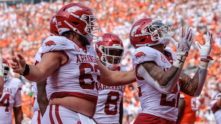 Arkansas Razorbacks running back JaQuinden Jackson (22) celebrates in the end zone after scoring a touchdown during the first quarter against the Oklahoma State Cowboys at Boone Pickens Stadium. 