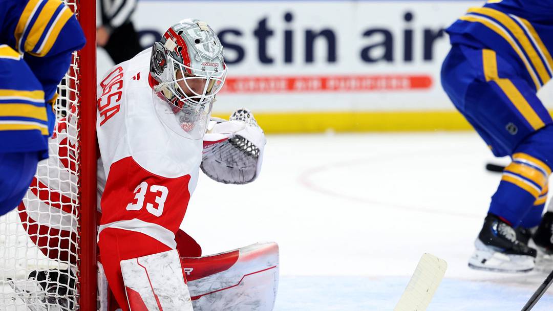 Dec 9, 2024; Buffalo, New York, USA;  Detroit Red Wings goaltender Sebastian Cossa (33) looks for the puck during the second period against the Buffalo Sabres at KeyBank Center. Mandatory Credit: Timothy T. Ludwig-Imagn Images