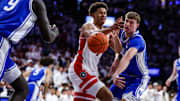 Duke Blue Devils forward Cooper Flagg hits the ball out of the hands of Arizona Wildcats forward Carter Bryant (9) during their matchup in November.