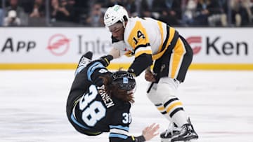 Jan 29, 2025; Salt Lake City, Utah, USA; Utah Hockey Club center Liam O'Brien (38) and Pittsburgh Penguins left wing Bokondji Imama (14) fight during the first period at Delta Center. Mandatory Credit: Rob Gray-Imagn Images
