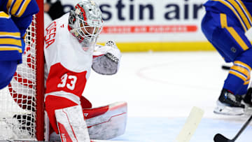Dec 9, 2024; Buffalo, New York, USA;  Detroit Red Wings goaltender Sebastian Cossa (33) looks for the puck during the second period against the Buffalo Sabres at KeyBank Center. Mandatory Credit: Timothy T. Ludwig-Imagn Images