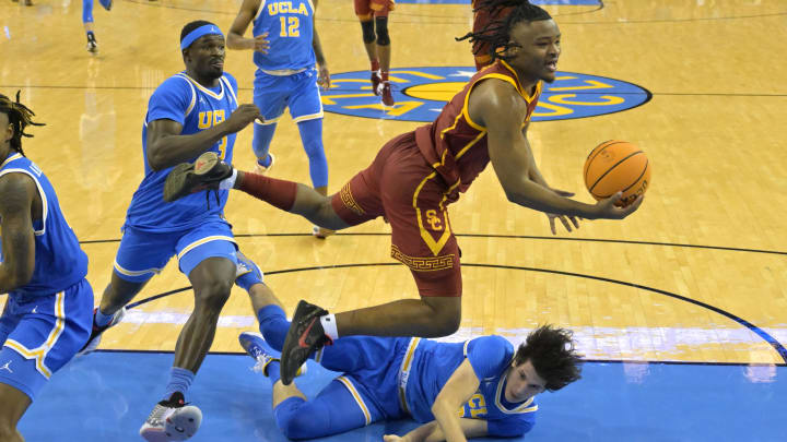 Feb 24, 2024; Los Angeles, California, USA;  USC Trojans guard Isaiah Collier (1) is fouled by UCLA.