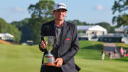 Keegan Bradley poses with the winner's trophy after the final round of the 2023 Travelers Championship.
