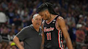 Apr 5, 2025; San Antonio, TX, USA;  Houston Cougars head coach Kelvin Sampson talks with Houston Cougars forward Joseph Tugler (11) against the Duke Blue Devils in the semifinals of the men's Final Four of the 2025 NCAA Tournament at the Alamodome.
