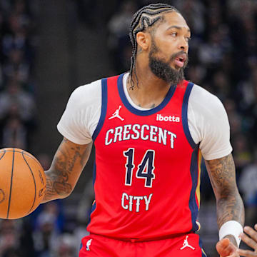 Nov 8, 2023; Minneapolis, Minnesota, USA; New Orleans Pelicans forward Brandon Ingram (14) dribbles against the Minnesota Timberwolves in the third quarter at Target Center.