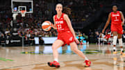 Indiana Fever guard Caitlin Clark (22) dribbles the ball against the Seattle Storm.