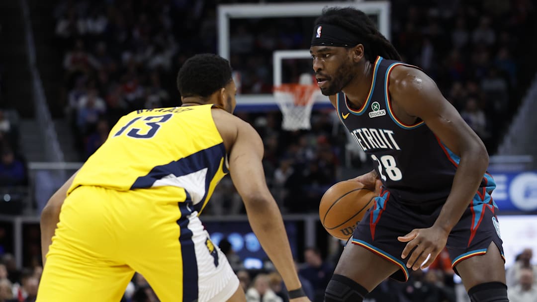 Jan 17, 2026; Detroit, Michigan, USA;  Detroit Pistons forward Isaiah Stewart (28) is defended by Indiana Pacers center Tony Bradley (13) in the first half at Little Caesars Arena. Mandatory Credit: Rick Osentoski-Imagn Images