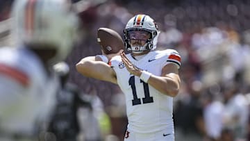 Sep 27, 2025; College Station, Texas, USA; Auburn Tigers quarterback Jackson Arnold (11) warms up before the game against the Texas A&M Aggies at Kyle Field. Mandatory Credit: Troy Taormina-Imagn Images
