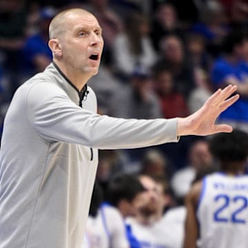 Mar 13, 2025; Nashville, TN, USA;  Kentucky Wildcats head coach Mark Pope gives instructions to his team against the Oklahoma Sooners during the first half at Bridgestone Arena. Mandatory Credit: Steve Roberts-Imagn Images