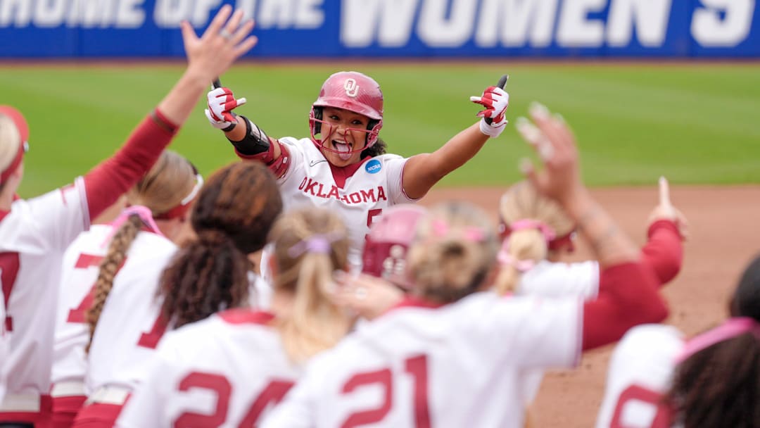 OU's Ella Parker (5) celebrates with her teammates after hitting a home run in the first inning against Tennessee during the Women's College World Series on Thursday, May 29, 2025, at Devon Park in Oklahoma City.
