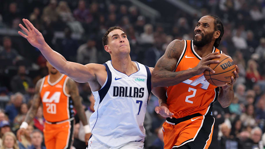 Clippers forward Kawhi Leonard drives to the basket against Mavericks forward/center Dwight Powell.