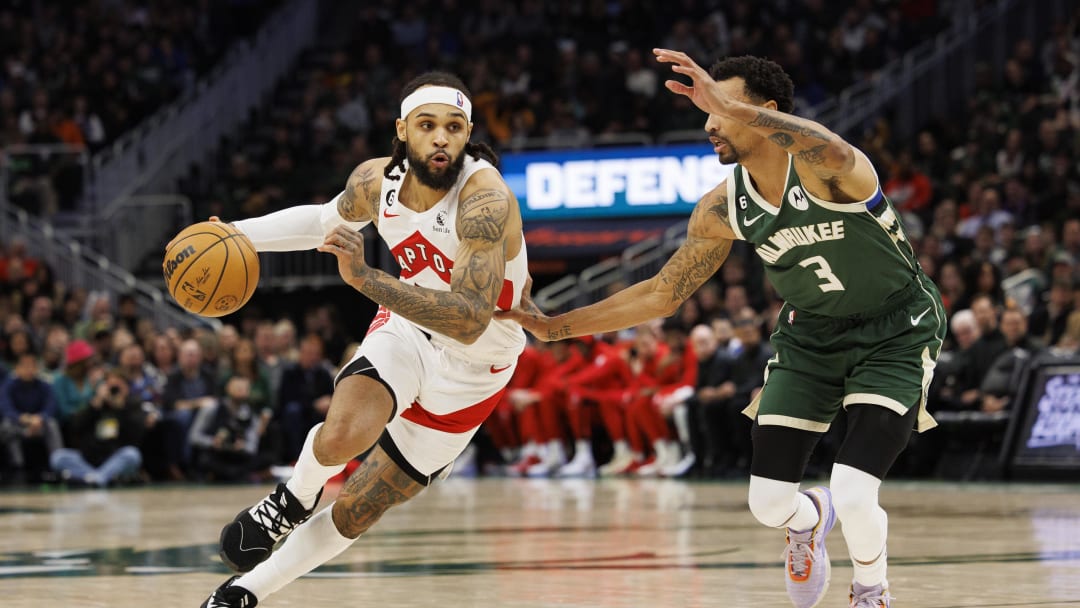 Jan 17, 2023; Milwaukee, Wisconsin, USA;  Toronto Raptors guard Gary Trent Jr. (33) drives for the basket against Milwaukee Bucks guard George Hill (3) during the fourth quarter at Fiserv Forum. Mandatory Credit: Jeff Hanisch-USA TODAY Sports