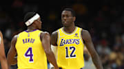 Oct 6, 2021; Phoenix, Arizona, USA; Los Angeles Lakers guard Rajon Rondo (4) and guard Kendrick Nunn (12) against the Phoenix Suns during a preseason game at Footprint Center. Mandatory Credit: Mark J. Rebilas-Imagn Images