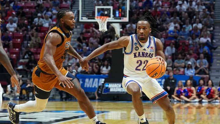 Mar 20, 2026; San Diego, CA, USA; Kansas Jayhawks guard Darryn Peterson (22) controls the ball against California Baptist Lancers guard Martel Williams (33) in the first half during a first round game of the men's 2026 NCAA Tournament at Viejas Arena. Mandatory Credit: Kirby Lee-Imagn Images