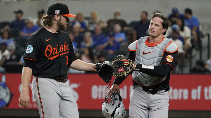 Jul 19, 2024; Arlington, Texas, USA; Baltimore Orioles pitcher Corbin Burnes (39) and catcher Adley Rutschman (35) tap mitts after retiring the Texas Rangers in the fourth inning at Globe Life Field.