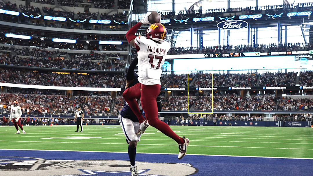 Jan 5, 2025; Arlington, Texas, USA; Washington Commanders wide receiver Terry McLaurin (17) catches the game winning touchdown against Dallas Cowboys cornerback DaRon Bland (26) during the fourth quarter at AT&T Stadium. Mandatory Credit: Tim Heitman-Imagn Images