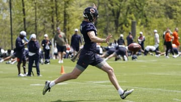 Rookie Bears punter Tory Taylor takes a stride before putting his foot into a punt during offseason work at Halas Hall.