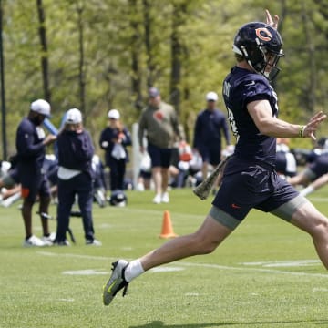 Rookie Bears punter Tory Taylor takes a stride before putting his foot into a punt during offseason work at Halas Hall.