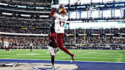 Jan 5, 2025; Arlington, Texas, USA; Washington Commanders wide receiver Terry McLaurin (17) catches the game winning touchdown against Dallas Cowboys cornerback DaRon Bland (26) during the fourth quarter at AT&T Stadium. Mandatory Credit: Tim Heitman-Imagn Images