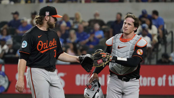 Jul 19, 2024; Arlington, Texas, USA; Baltimore Orioles pitcher Corbin Burnes (39) and catcher Adley Rutschman (35) tap mitts after retiring the Texas Rangers in the fourth inning at Globe Life Field.