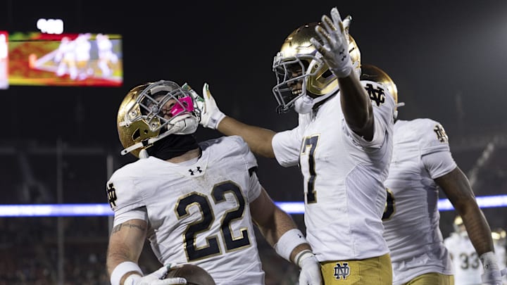 Nov 29, 2025; Stanford, California, USA;  Notre Dame Fighting Irish running back Aneyas Williams (22) celebrates with Notre Dame Fighting Irish tight end Ty Washington (7) after scoring a touchdown during the fourth quarter against the Stanford Cardinal at Stanford Stadium. Mandatory Credit: Stan Szeto-Imagn Images