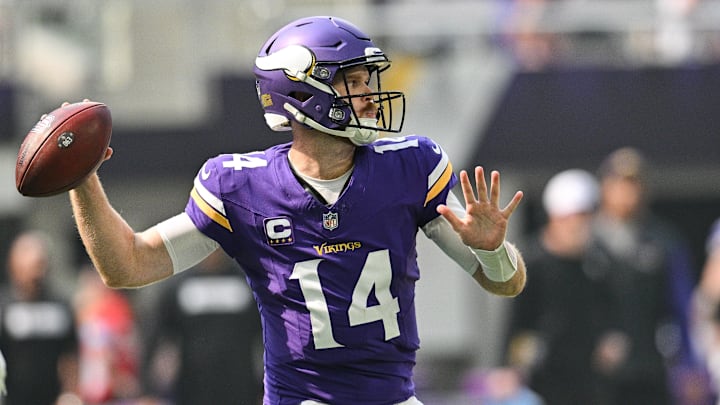 Sep 15, 2024; Minneapolis, Minnesota, USA; Minnesota Vikings quarterback Sam Darnold (14) throws a pass against the San Francisco 49ers during the first quarter U.S. Bank Stadium.