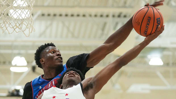 Indiana All-Star Junior Flory Bidunga (20) blocks a lay-up from Indiana All-Star Markus Burton (1) on Wednesday, June 7, 2023