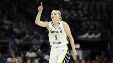 Jul 9, 2025; Chicago, Illinois, USA; Dallas Wings guard Paige Bueckers (5) reacts after scoring against the Chicago Sky during the first half at Wintrust Arena. Mandatory Credit: Kamil Krzaczynski-Imagn Images