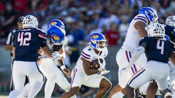 Nov 8, 2025; Tucson, Arizona, USA; Kansas Jayhawks running back Daniel Hishaw Jr. (9) against the Arizona Wildcats at Arizona Stadium. Mandatory Credit: Mark J. Rebilas-Imagn Images