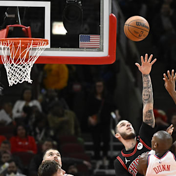 Feb 26, 2025; Chicago, Illinois, USA;  Chicago Bulls guard Lonzo Ball (2) defends against LA Clippers guard Kris Dunn (8) during the second half  at the United Center. Mandatory Credit: Matt Marton-Imagn Images