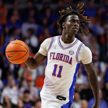 Mar 8, 2025; Gainesville, Florida, USA; Florida Gators guard Denzel Aberdeen (11) dribbles the ball against the Mississippi Rebels during the second half at Exactech Arena at the Stephen C. O'Connell Center. Mandatory Credit: Matt Pendleton-Imagn Images
