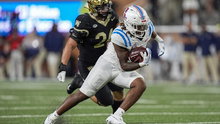 Sep 14, 2024; Winston-Salem, North Carolina, USA;  Wake Forest Demon Deacons linebacker Dylan Hazen (24) chases after Mississippi Rebels running back Matt Jones (0) during the second half at Allegacy Federal Credit Union Stadium. Mandatory Credit: Jim Dedmon-Imagn Images