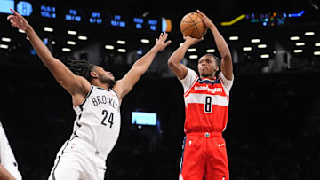 Oct 14, 2024; Brooklyn, New York, USA; Washington Wizards guard Bub Carrington (8) shoots a jump shot over Brooklyn Nets small guard Cam Thomas (24) during the second half at Barclays Center. Mandatory Credit: Gregory Fisher-Imagn Images