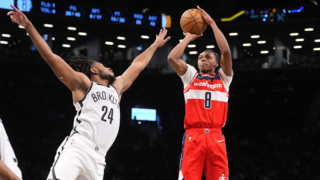 Oct 14, 2024; Brooklyn, New York, USA; Washington Wizards guard Bub Carrington (8) shoots a jump shot over Brooklyn Nets small guard Cam Thomas (24) during the second half at Barclays Center. Mandatory Credit: Gregory Fisher-Imagn Images