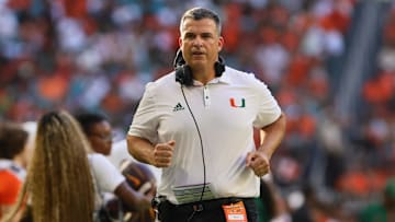 Sep 7, 2024; Miami Gardens, Florida, USA; Miami Hurricanes head coach Mario Cristobal runs on the sideline against the Florida A&M Rattlers during the first quarter at Hard Rock Stadium.