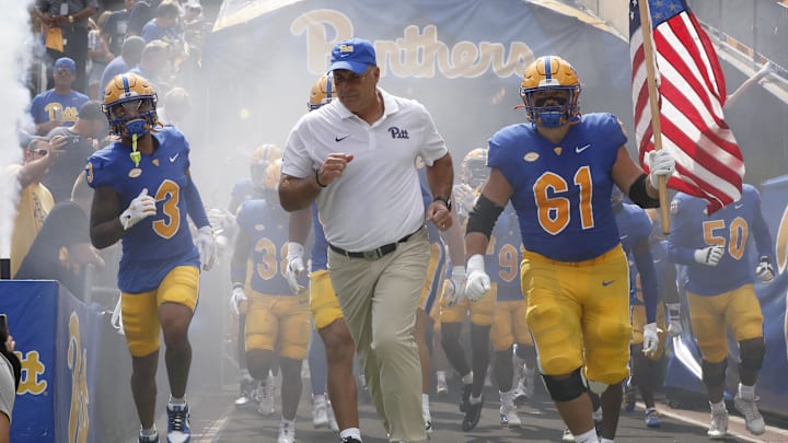 Aug 31, 2024; Pittsburgh, Pennsylvania, USA;  Pittsburgh Panthers defensive back Donovan McMillon (3) and head coach Pat Narduzzi and Pittsburgh Panthers offensive lineman Ryan Jacoby (61) lead the team onto the field against the Kent State Golden Flashes at Acrisure Stadium. Mandatory Credit: Charles LeClaire-Imagn Images