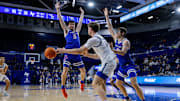 Air Force forward Caleb Walker passes the ball as Boise State guard RJ Keene II (5) and forward Andrew Meadow (13) defend.