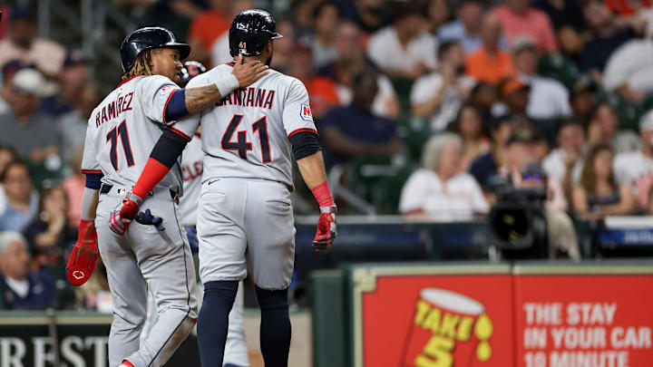 Cleveland Guardians stars Jose Ramirez and Carlos Santana walk off the field together.