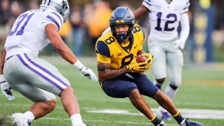 Sep 22, 2018; Morgantown, WV, USA; West Virginia Mountaineers wide receiver Marcus Simms (8) catches a pass and runs for extra yards during the fourth quarter against the Kansas State Wildcats at Mountaineer Field at Milan Puskar Stadium. 