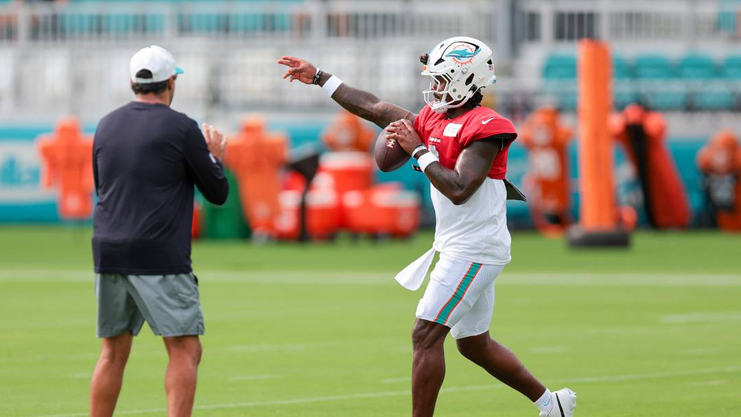 Aug 3, 2026; Miami Gardens, FL, USA; Miami Dolphins quarterback Malik Willis (2) works with quarterback coach Bush Hamdan during practice at Baptist Health Training Complex. Mandatory Credit: Sam Navarro-Imagn Images