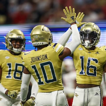 Sep 1, 2023; Atlanta, Georgia, USA; Georgia Tech Yellow Jackets defensive back K.J. Wallace (16) reacts after a pass breakup with defensive back Kenan Johnson (10) against the Louisville Cardinals in the first quarter at Mercedes-Benz Stadium. Mandatory Credit: Brett Davis-Imagn Images