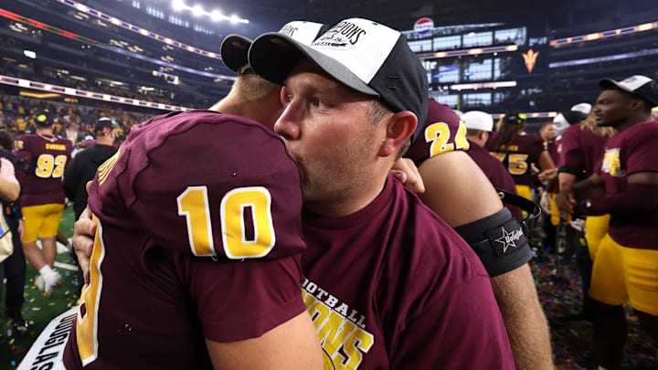 Arizona State QB Sam Leavitt and head coach Kenny Dillingham celebrate the Sun Devils' 45-19 victory over Iowa State in the Big 12 Conference championship game Saturday, Dec. 7, 2024.