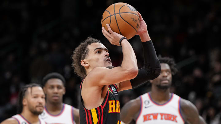 Jan 20, 2023; Atlanta, Georgia, USA; Atlanta Hawks guard Trae Young (11) shoots a foul shot watched by New York Knicks players after a technical foul call during the second half at State Farm Arena. Mandatory Credit: Dale Zanine-USA TODAY Sports