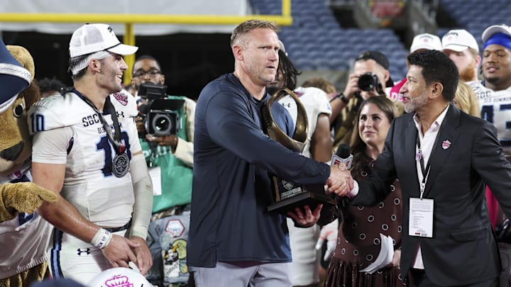 Dec 17, 2025; Orlando, FL, USA; Old Dominion Monarchs head coach Ricky Rahne reacts after beating the South Florida Bulls in the Cure Bowl at Camping World Stadium. Mandatory Credit: Nathan Ray Seebeck-Imagn Images