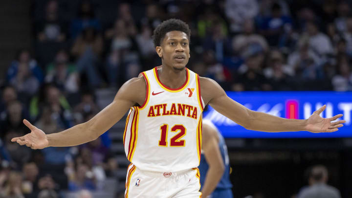 Apr 12, 2024; Minneapolis, Minnesota, USA; Atlanta Hawks forward De'Andre Hunter (12) reacts after making a three point shot in the second half against the Minnesota Timberwolves at Target Center. Mandatory Credit: Jesse Johnson-USA TODAY Sports