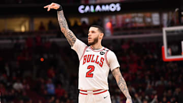  Chicago Bulls forward Lonzo Ball hits a three point shot against Toronto Raptors guard Jamal Shead during overtime at the United Center. 