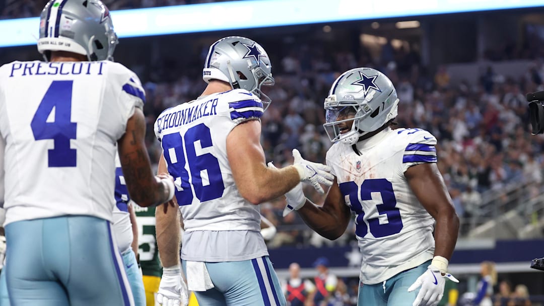 Sep 28, 2025; Arlington, Texas, USA; Dallas Cowboys running back Javonte Williams (33) celebrates with tight end Luke Schoonmaker (86) after scoring a touchdown against the Green Bay Packers in the fourth quarter at AT&T Stadium. 