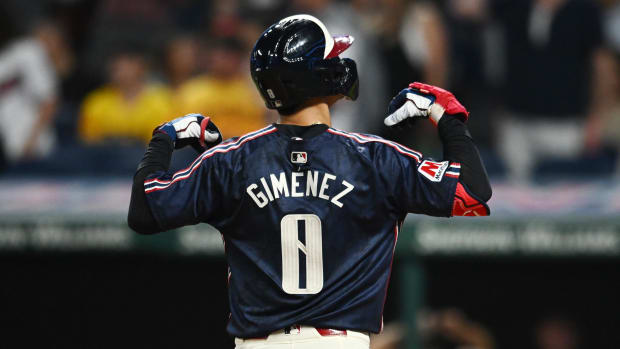 Andres Gimenez celebrates after hitting a home run 